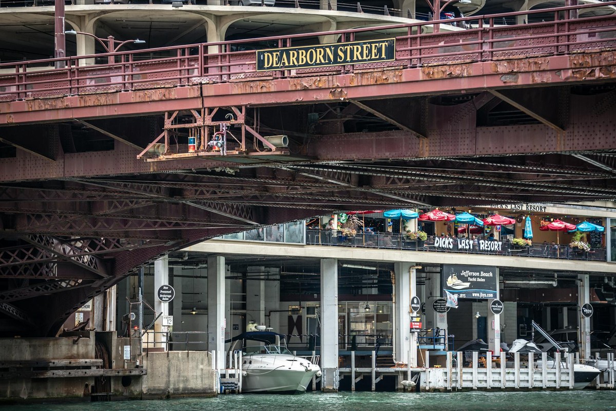 View of Dearborn Street Bridge in Chicago over the river with boat dock area.