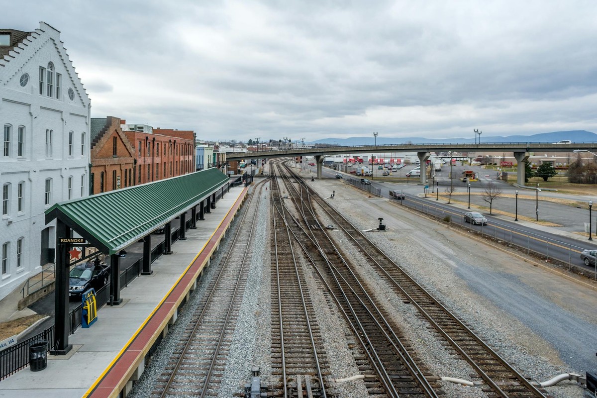 Elevated view of Roanoke train station with railway tracks, showcasing urban transportation infrastructure.