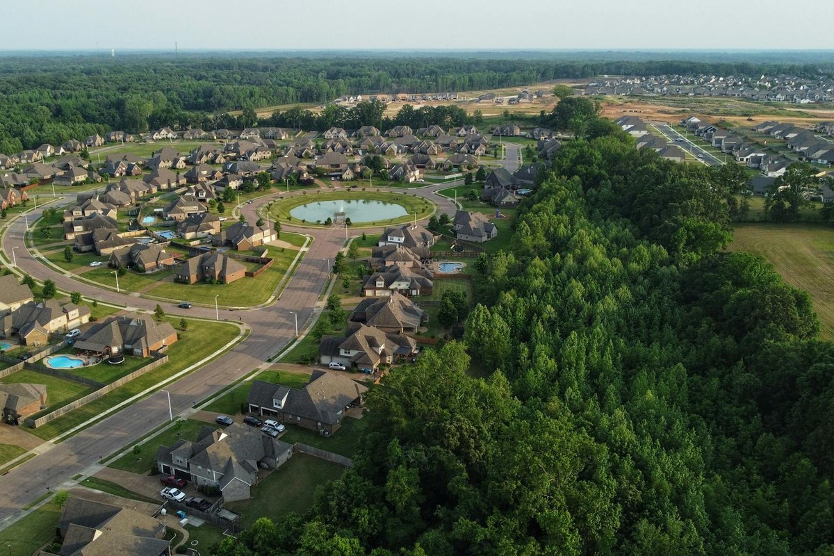 Aerial view showcasing a suburban neighborhood in Memphis, TN with houses and trees.