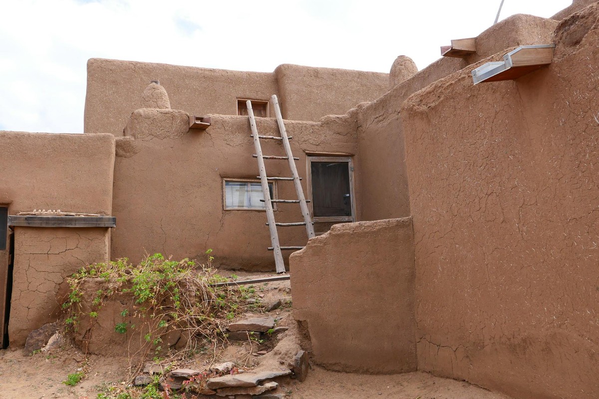 Traditional adobe architecture in Taos Pueblo, New Mexico showcasing rustic charm.