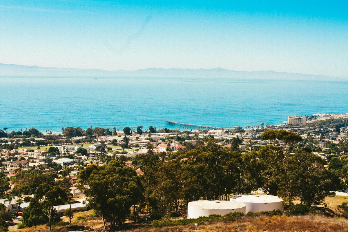 A stunning aerial view of Ventura, California capturing the coastal town and ocean on a sunny day.