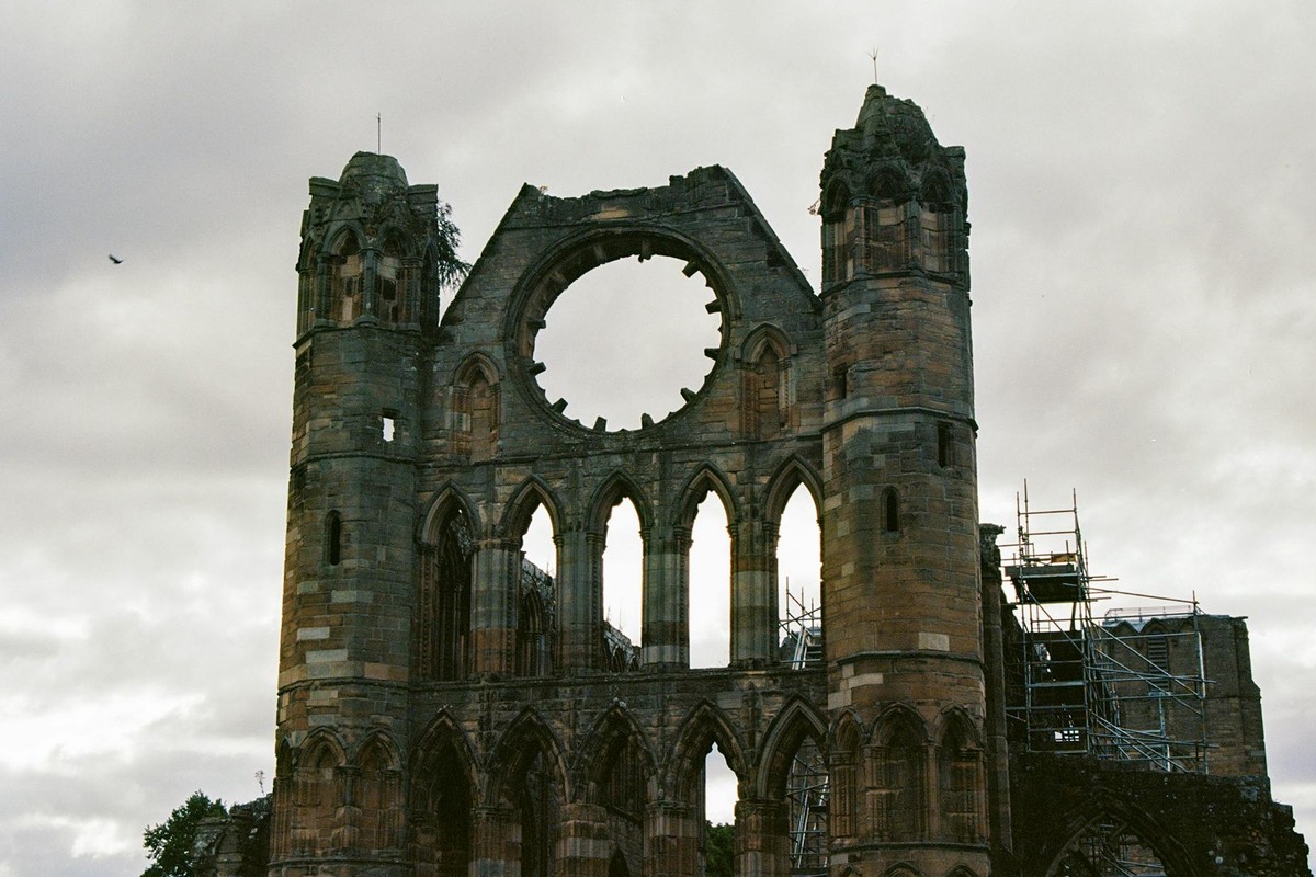 Capture of the majestic ruins of Elgin Cathedral against a cloudy Scottish sky.