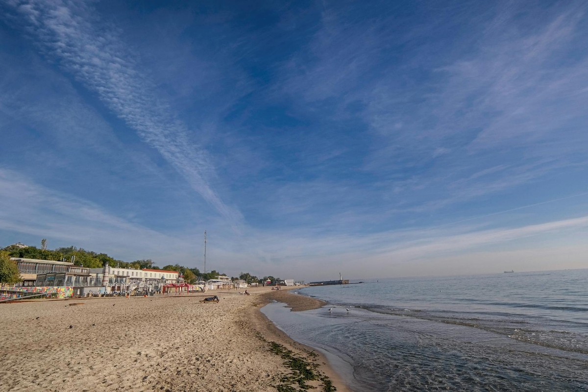 Beautiful sandy beach with blue sky in Odessa, Ukraine. Ideal for travel and leisure visuals.