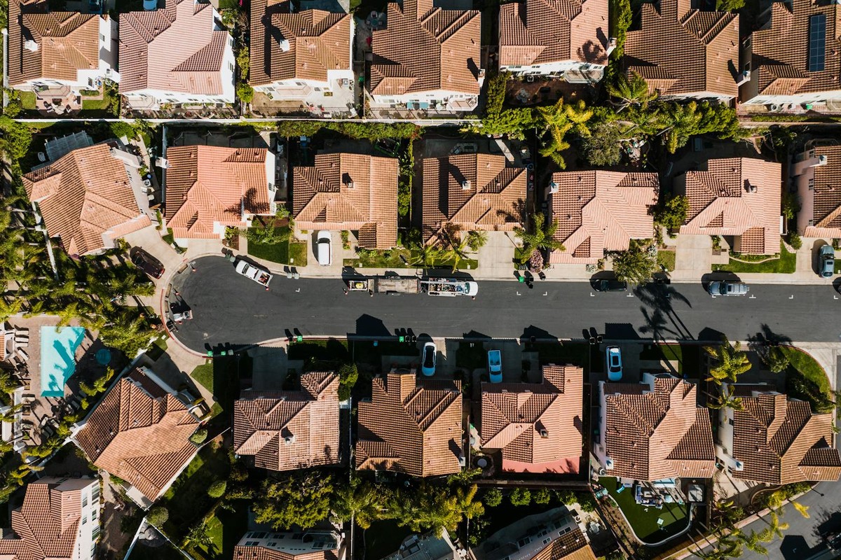 Aerial photograph showcasing a suburban neighborhood in Costa Mesa, CA, with neatly arranged houses and streets.