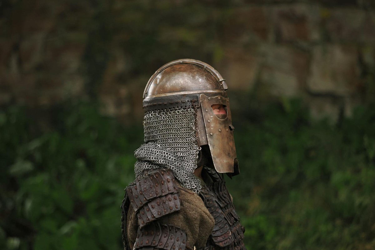 A knight in full medieval armor standing outdoors in Höxter, Germany.