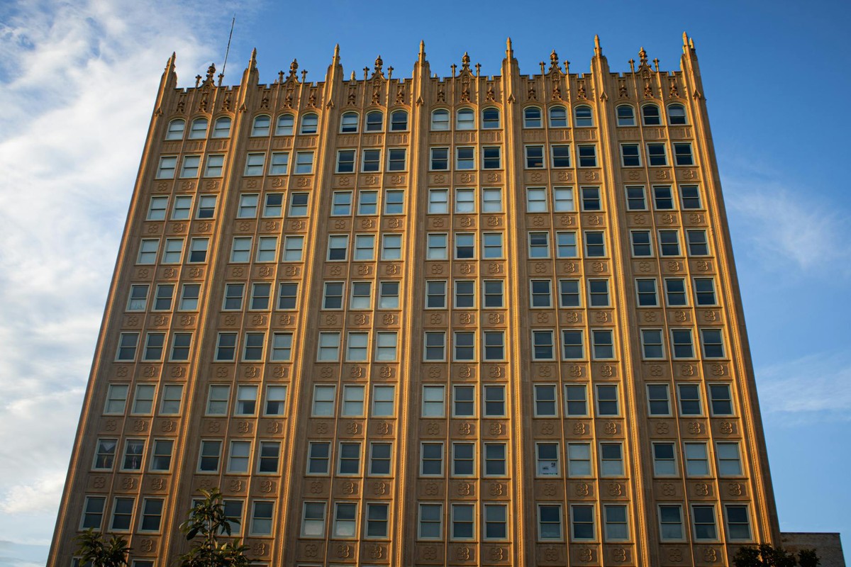 Golden architecture of a historic building in Midland, Texas under a clear blue sky.