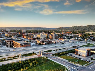 Aerial panorama of Winona, Minnesota showcasing the city's skyline at sunset.