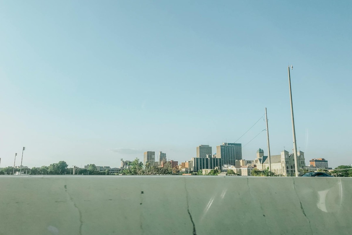 Scenic view of downtown Dayton skyline under a clear blue sky, ideal for urban landscapes.