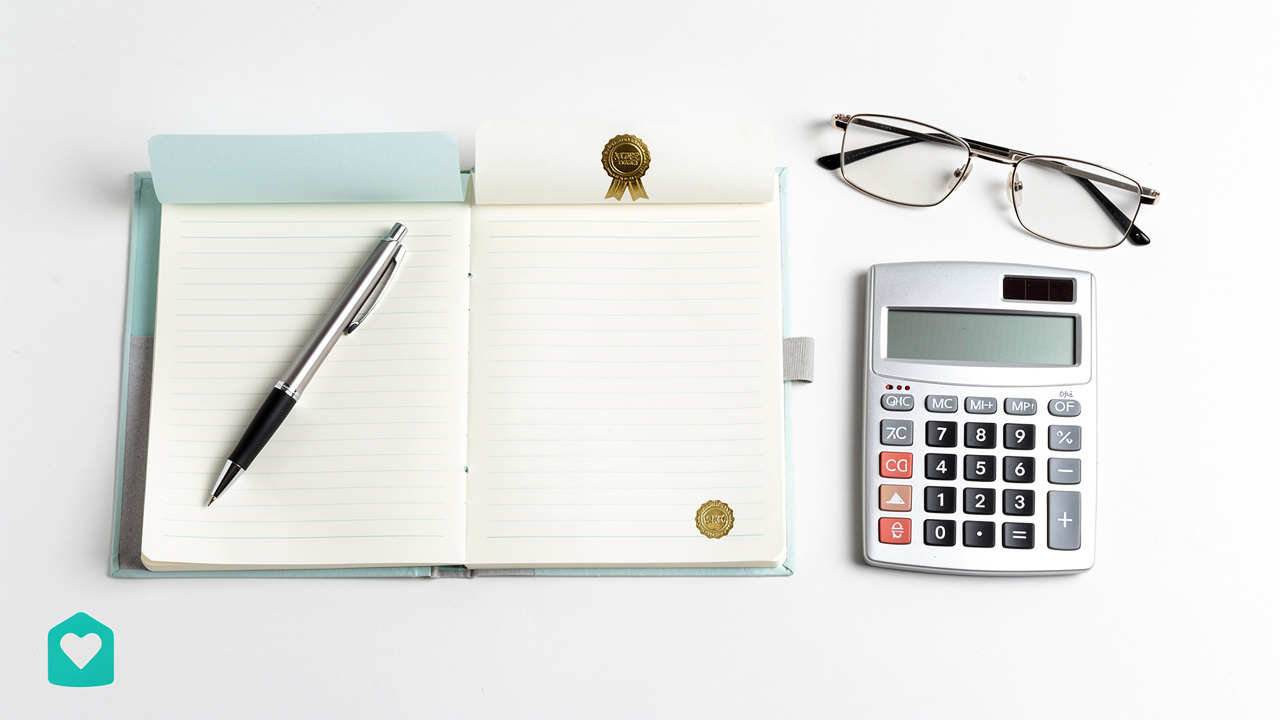Overhead view of estate financial documents and ledger on desk