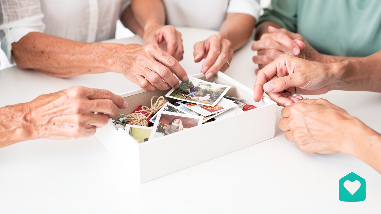 Hands sorting through boxes of keepsakes while downsizing