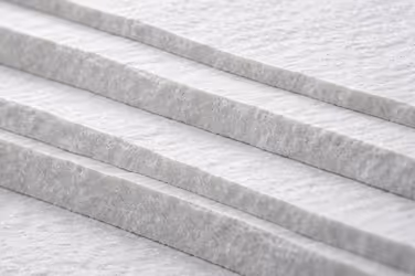 Macro photography of dark, rugged rock surface, representing operational resilience and independent assessment.