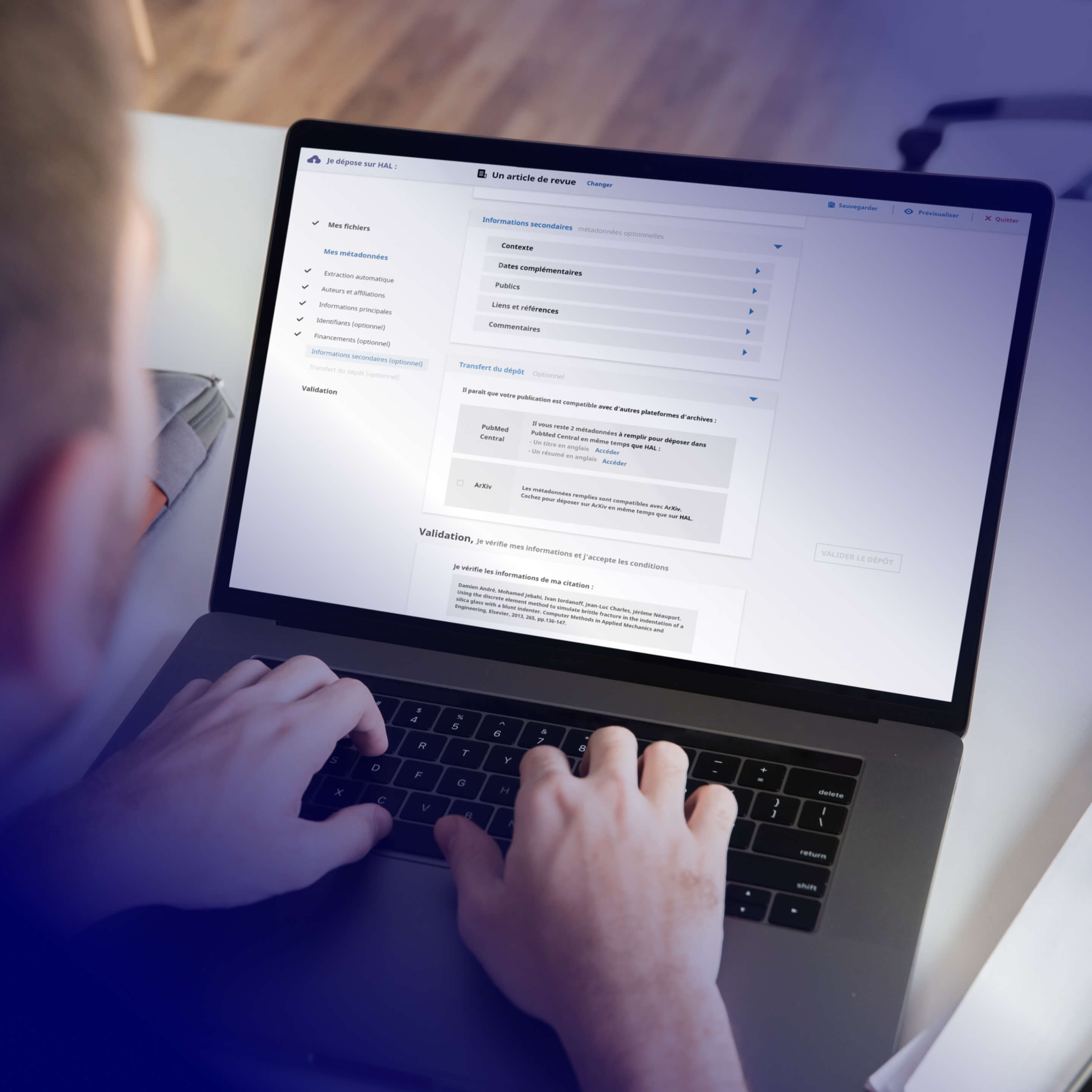 Photo capturing a man using the redesigned HAL platform on a laptop.