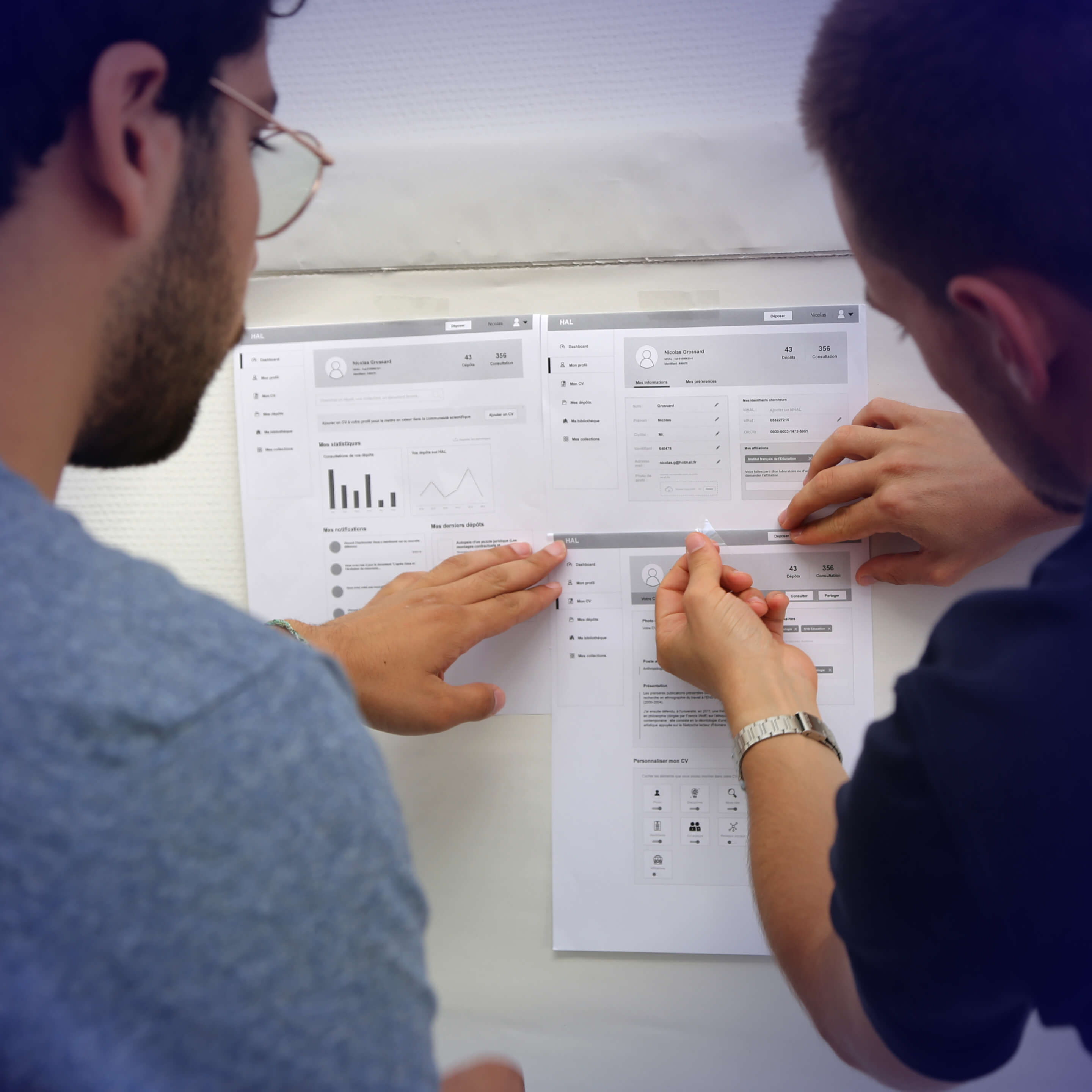 Photo showing me and a colleague engaged in prototyping the new HAL platform with wireframes.