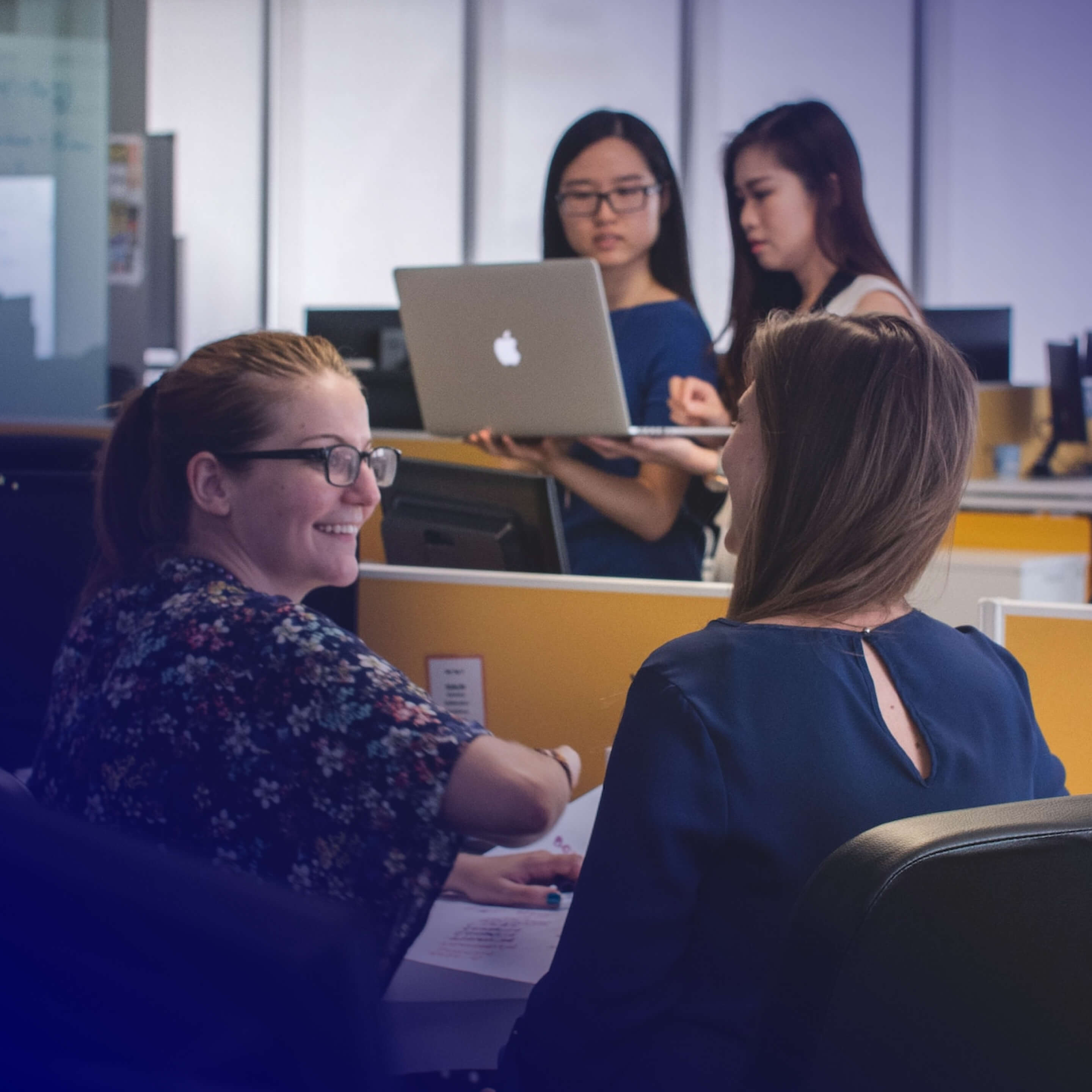 Photo illustrating researchers studying and collaborating within an academic environment. / Photo by Mimi Thian on Unsplash.