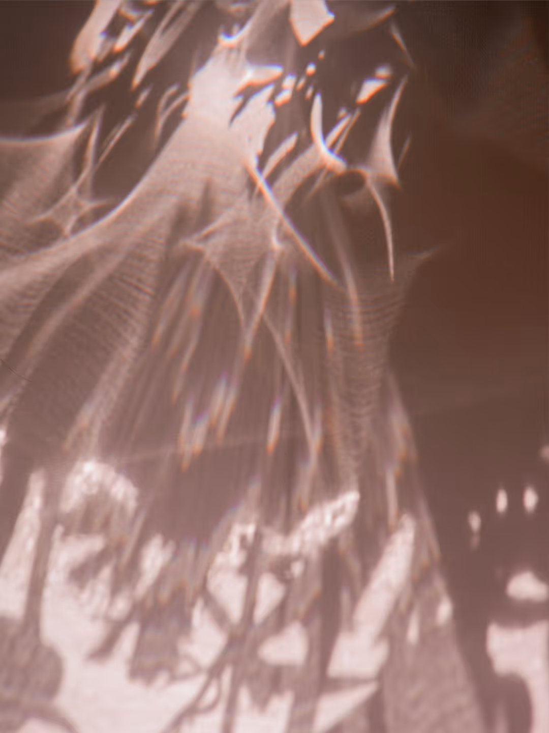 Abstract flowing shapes with soft light and shadow effects creating a smooth, textured pattern.