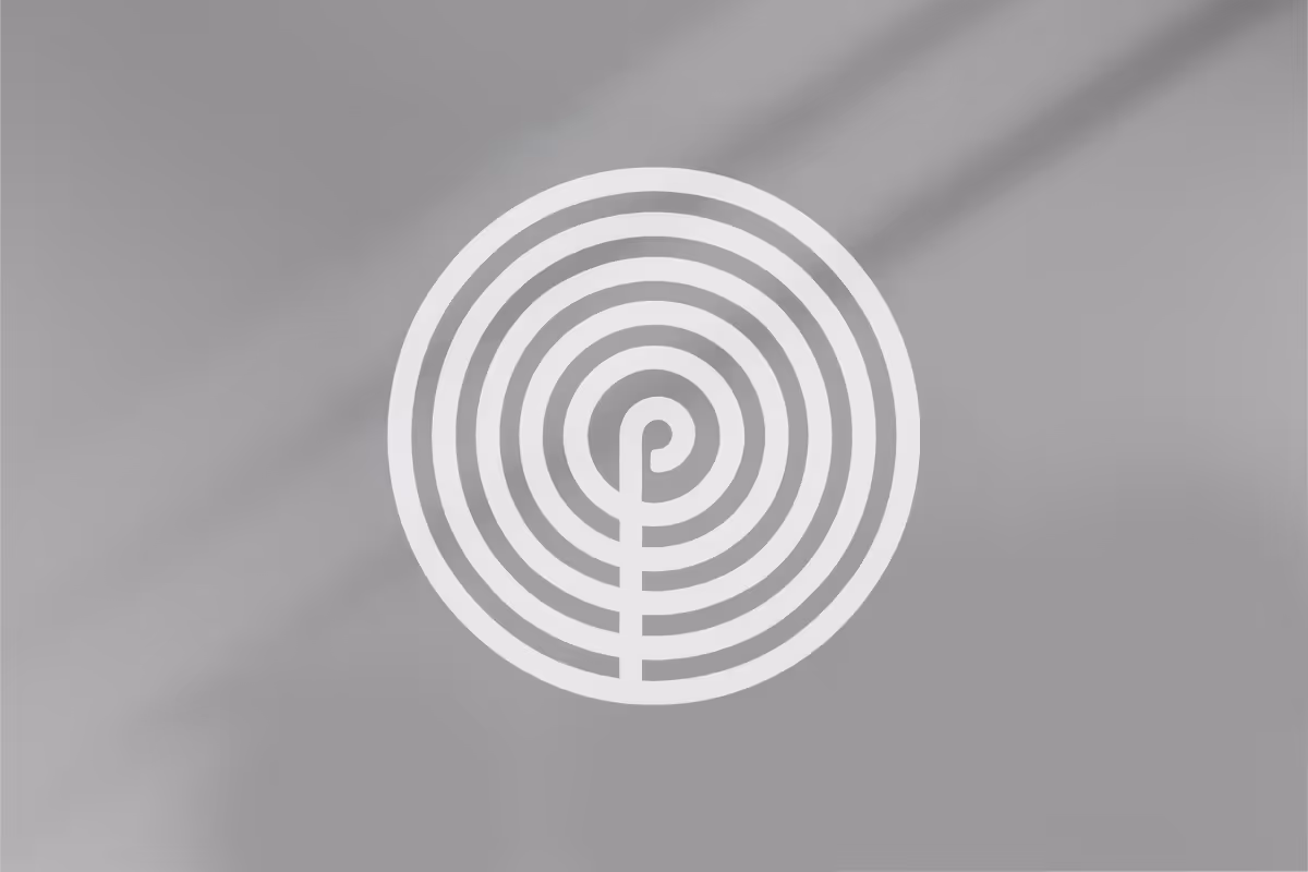 White circular labyrinth pattern on a gray background.