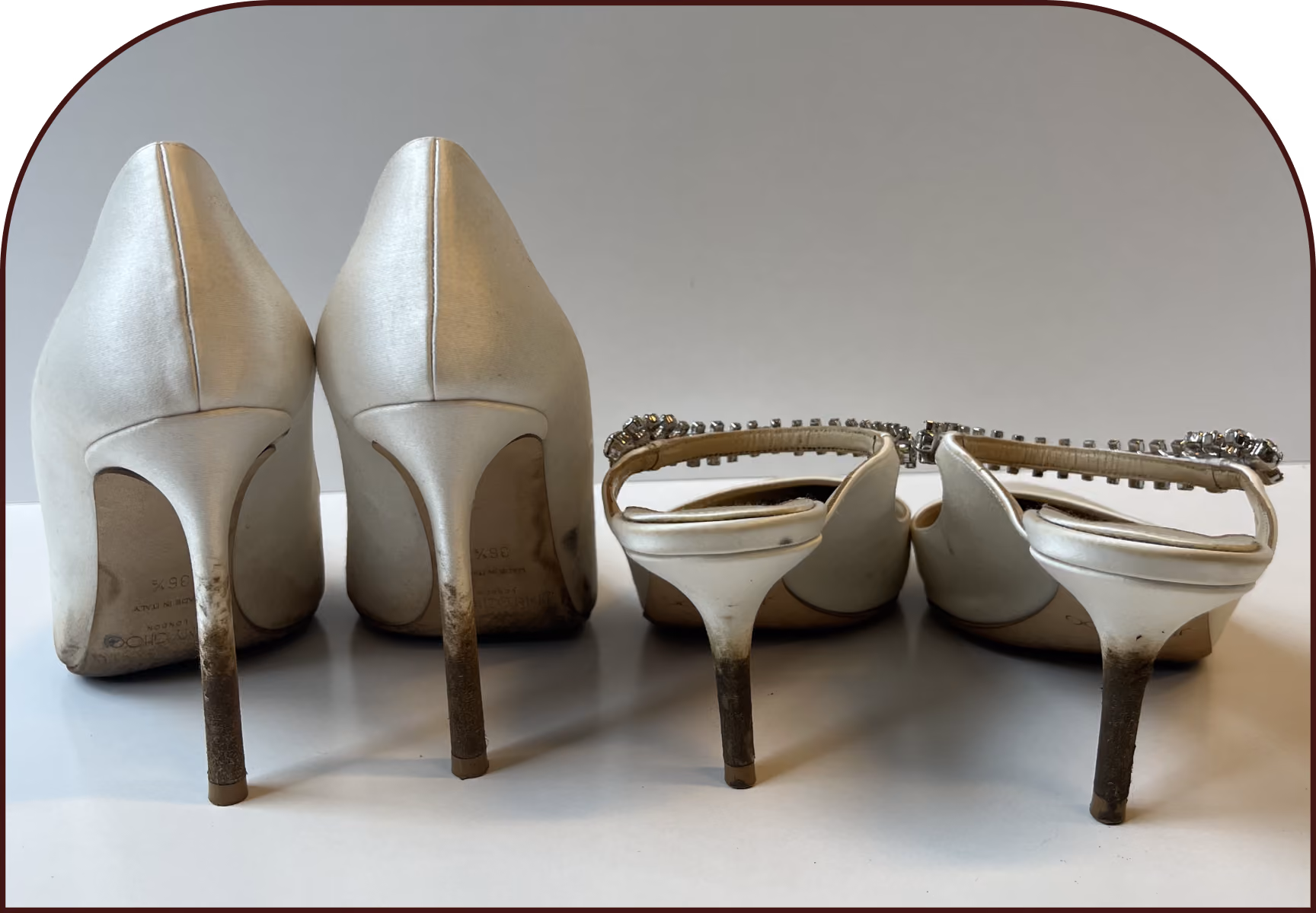 Close-up of dirty heels and soles on ivory Jimmy Choo satin shoes before bridal shoe cleaning by The Reco Lab