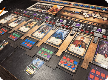 Physical Battle Ark prototype showing character cards, battle tracks, tokens, and player boards.