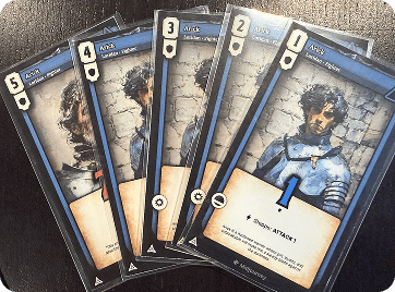 Five printed versions of an Arick character card arranged in a fan.