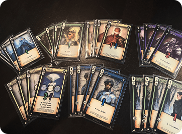 Multiple sets of printed fantasy character cards arranged on a tabletop.