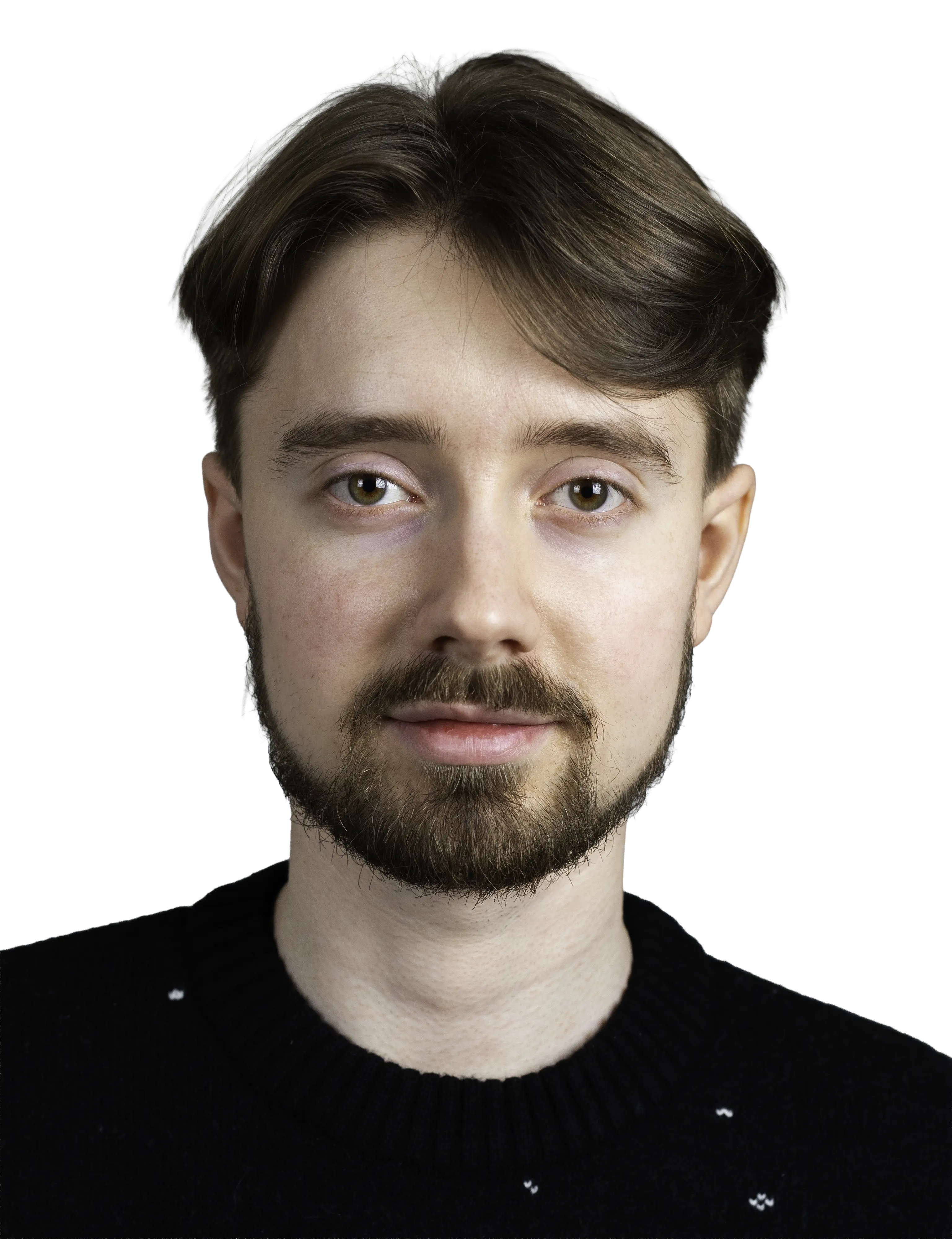 Young man with brown hair and beard wearing a black sweater, looking directly at the camera.
