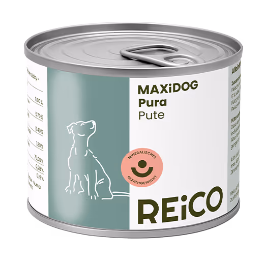Can of REICO MaxiDOG Pura Pute dog food with a pull-tab lid and dog illustration on the label.