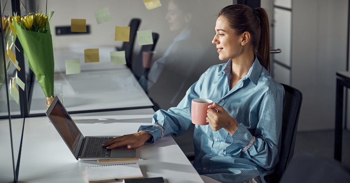 woman happy at computer
