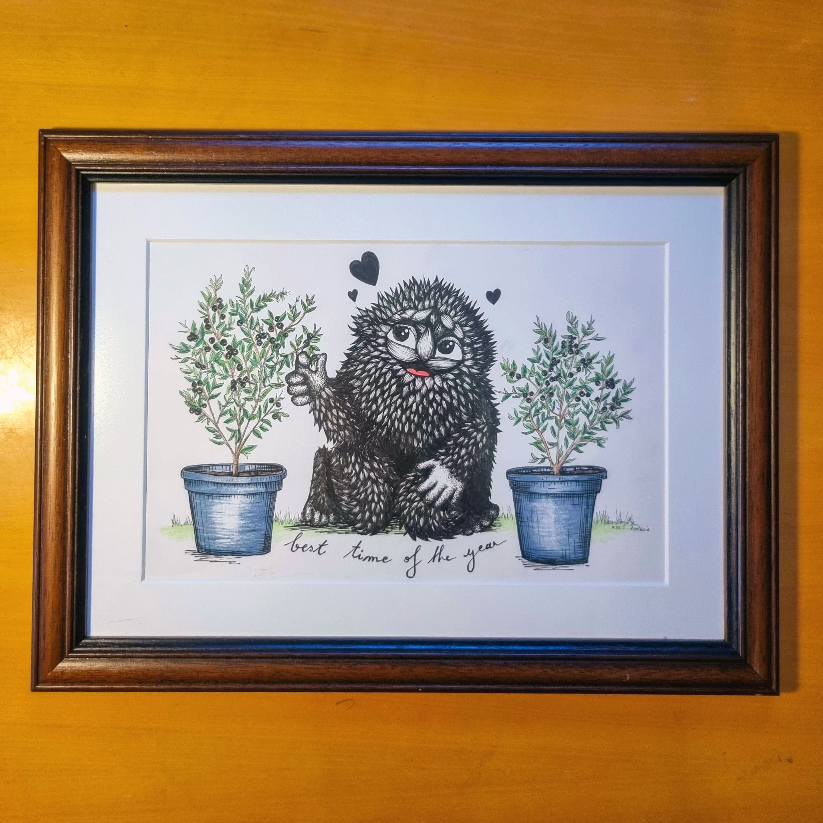 Cute furry black monster eating blueberry