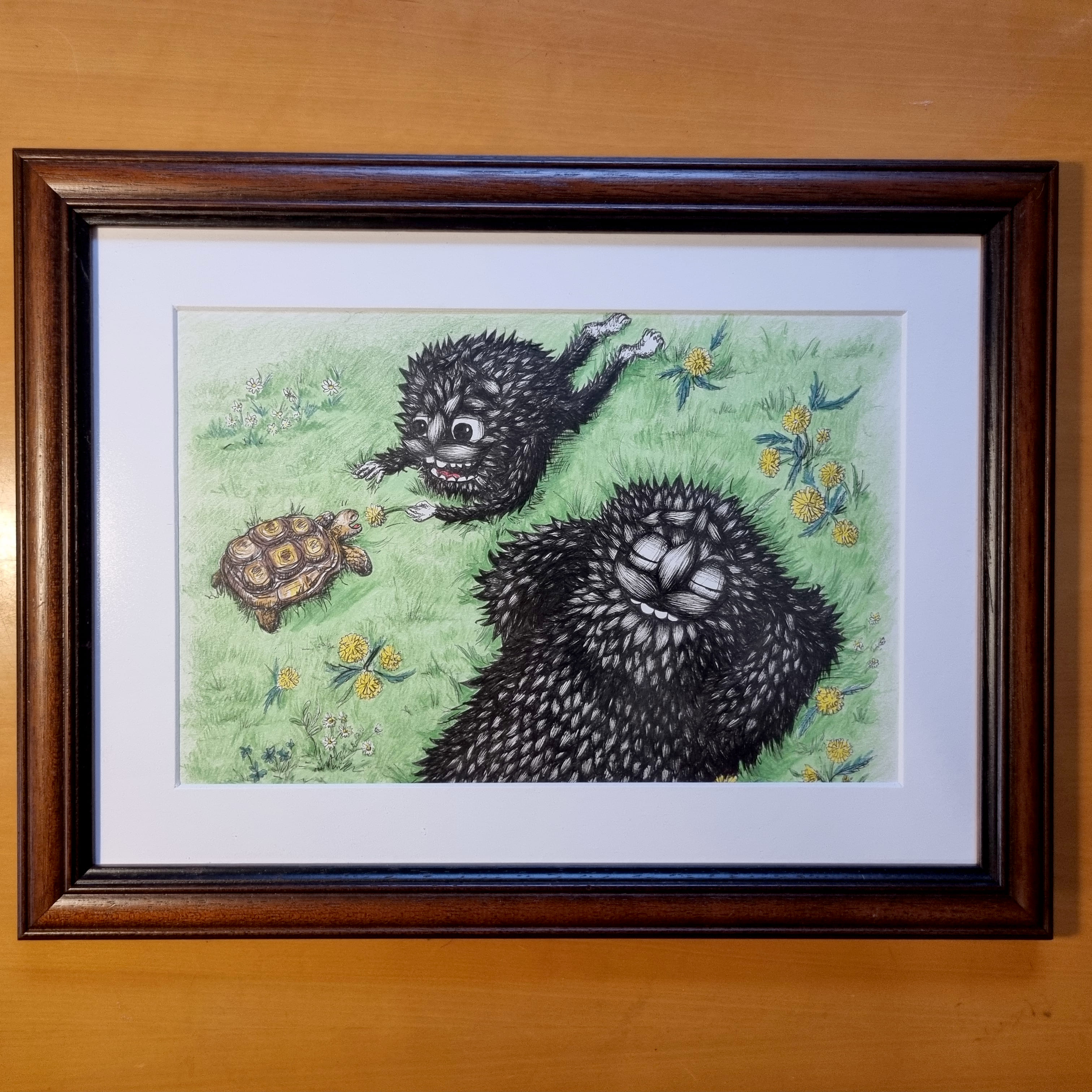 Cute drawing of a big black furry monster with his child in garden. The small monster is feeding a turtle.