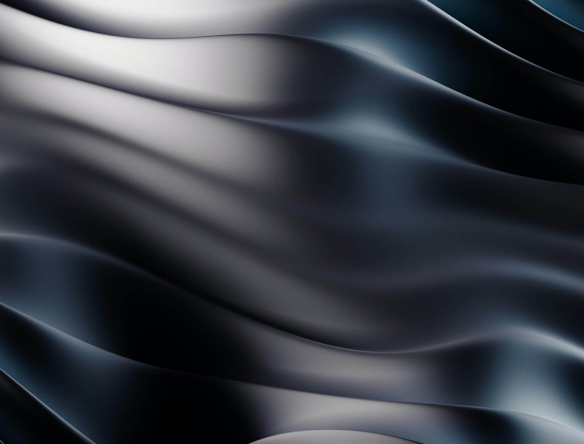 Smooth, glossy black silk fabric with gentle waves and soft light reflections.