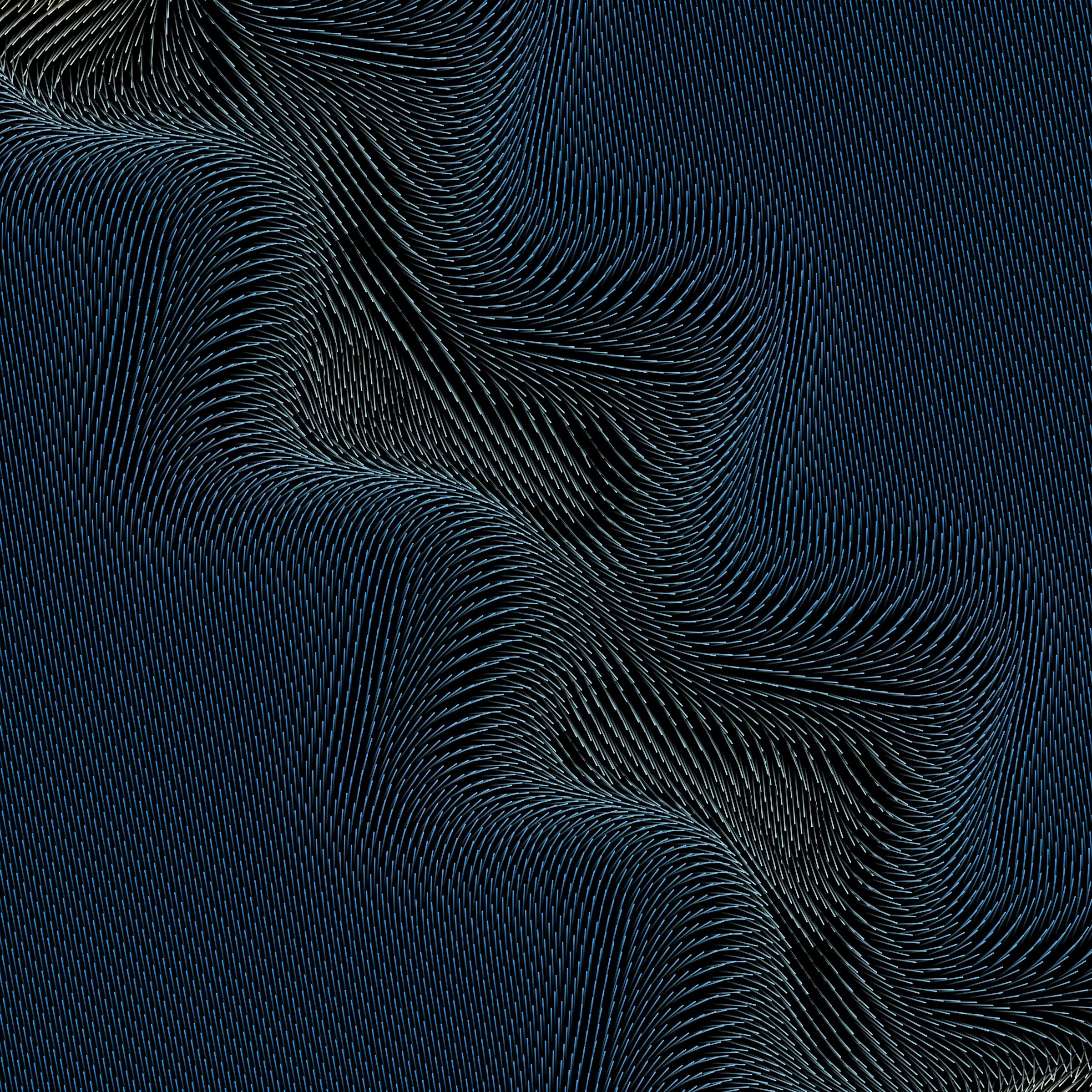 Two small black square-shaped stools casting shadows on a textured green surface.