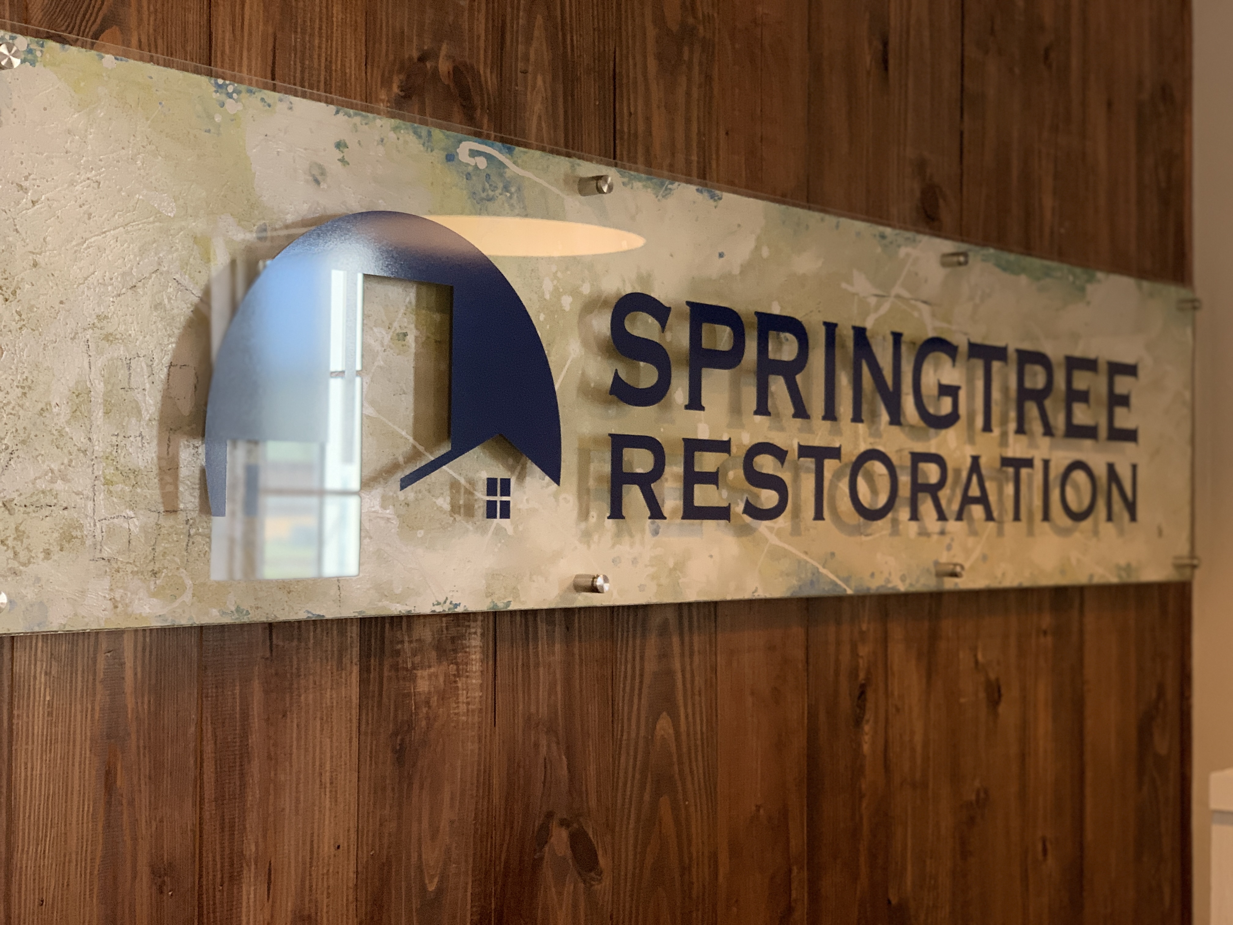 Two Springtree Restoration team members shaking hands