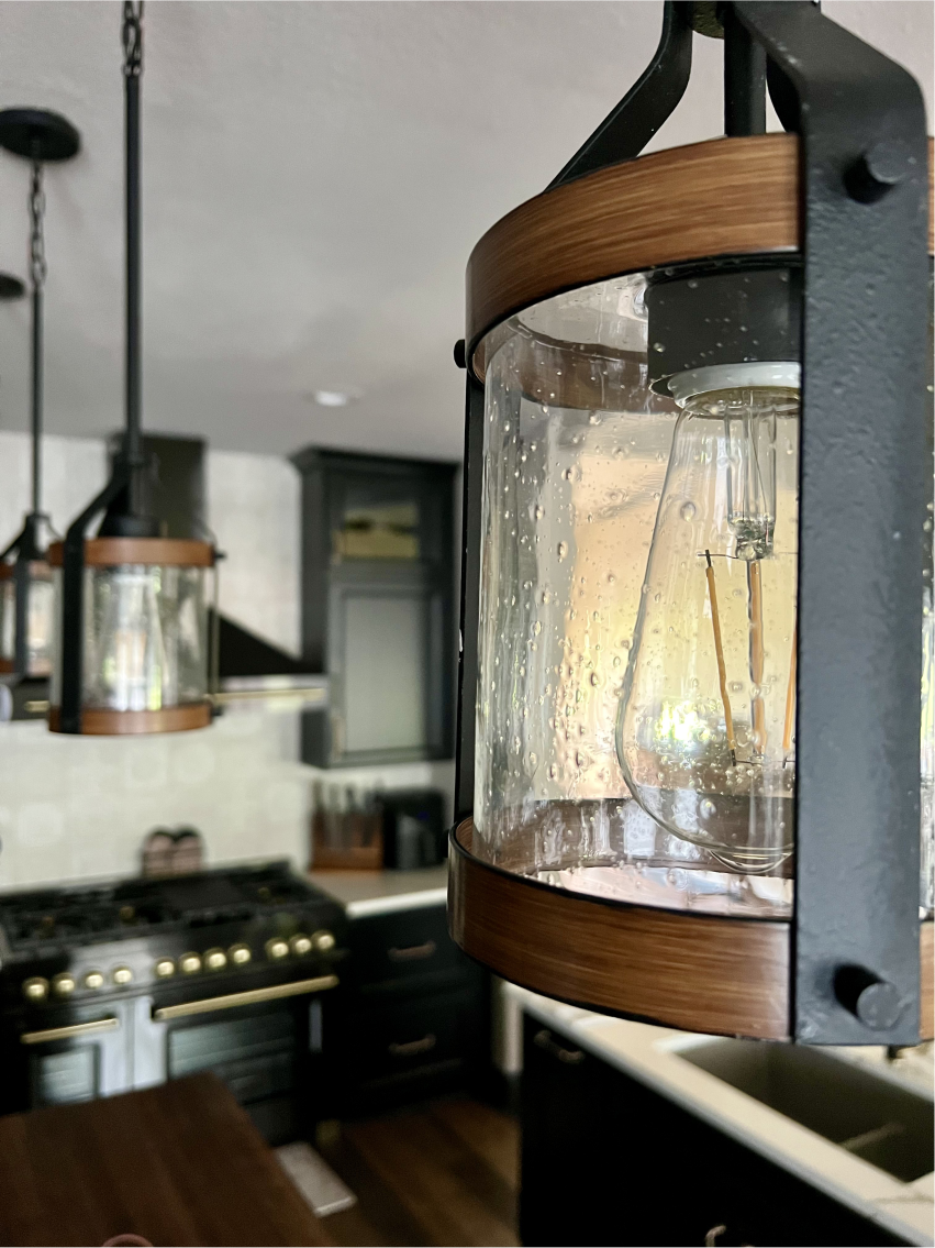 Glass pendant lighting above the kitchen island