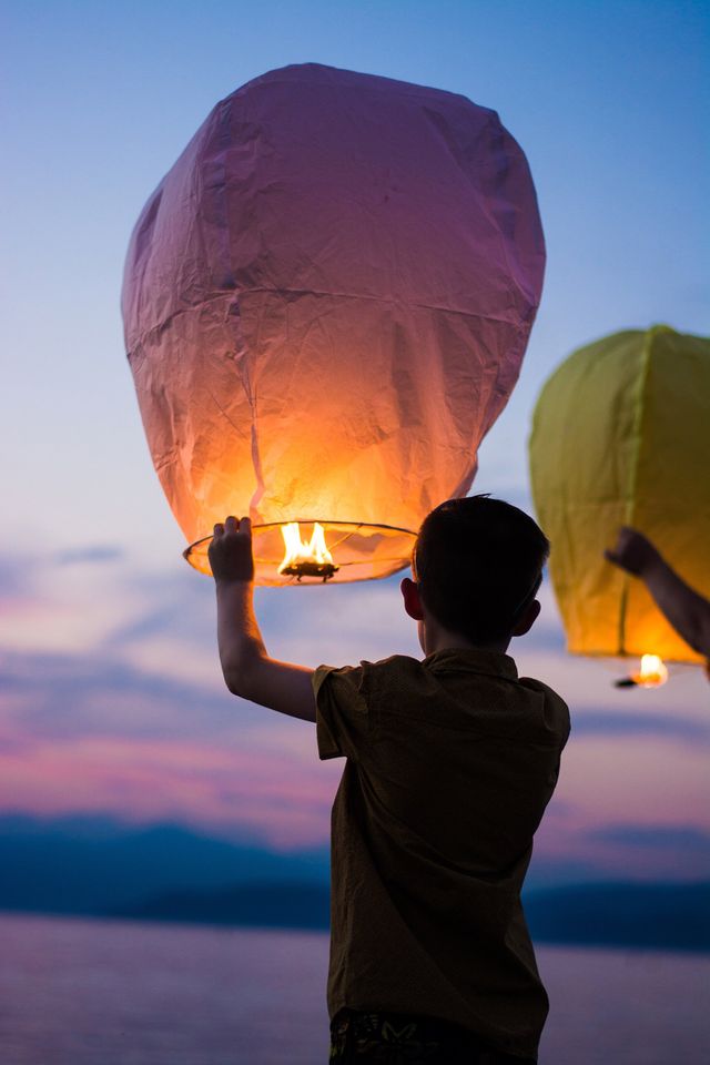 Boy with lantern ready to release