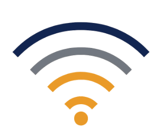 Man in a white shirt and tie excitedly reacting with mouth wide open during a conversation at an office table.