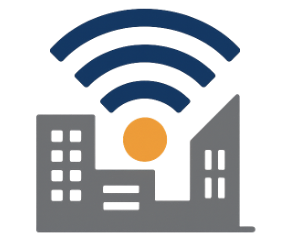 Man in a white shirt and tie excitedly reacting with mouth wide open during a conversation at an office table.