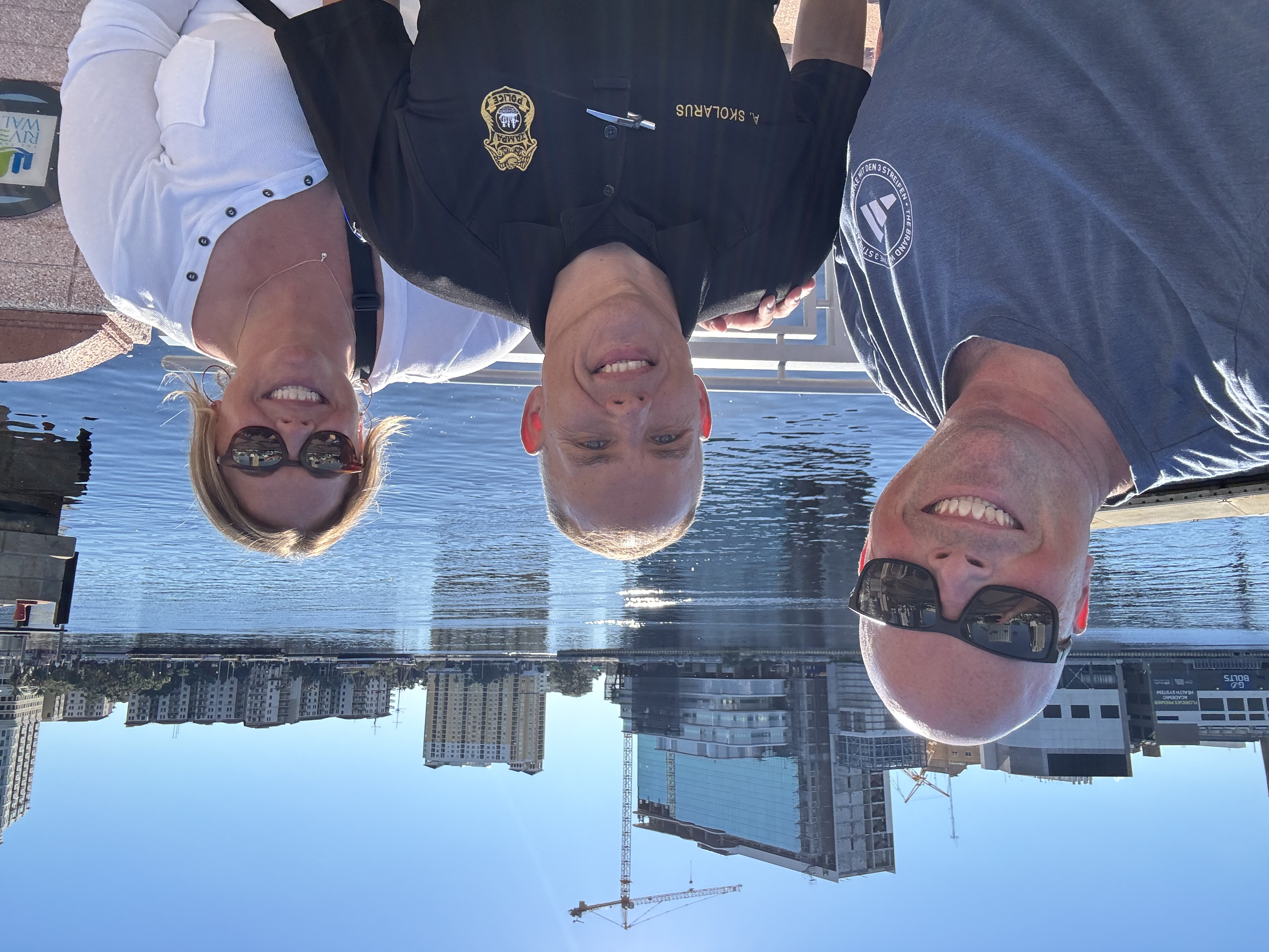 Brenda Grigsby and Terry Owens with Lt. Tony Skolarus of the Tampa Police Department