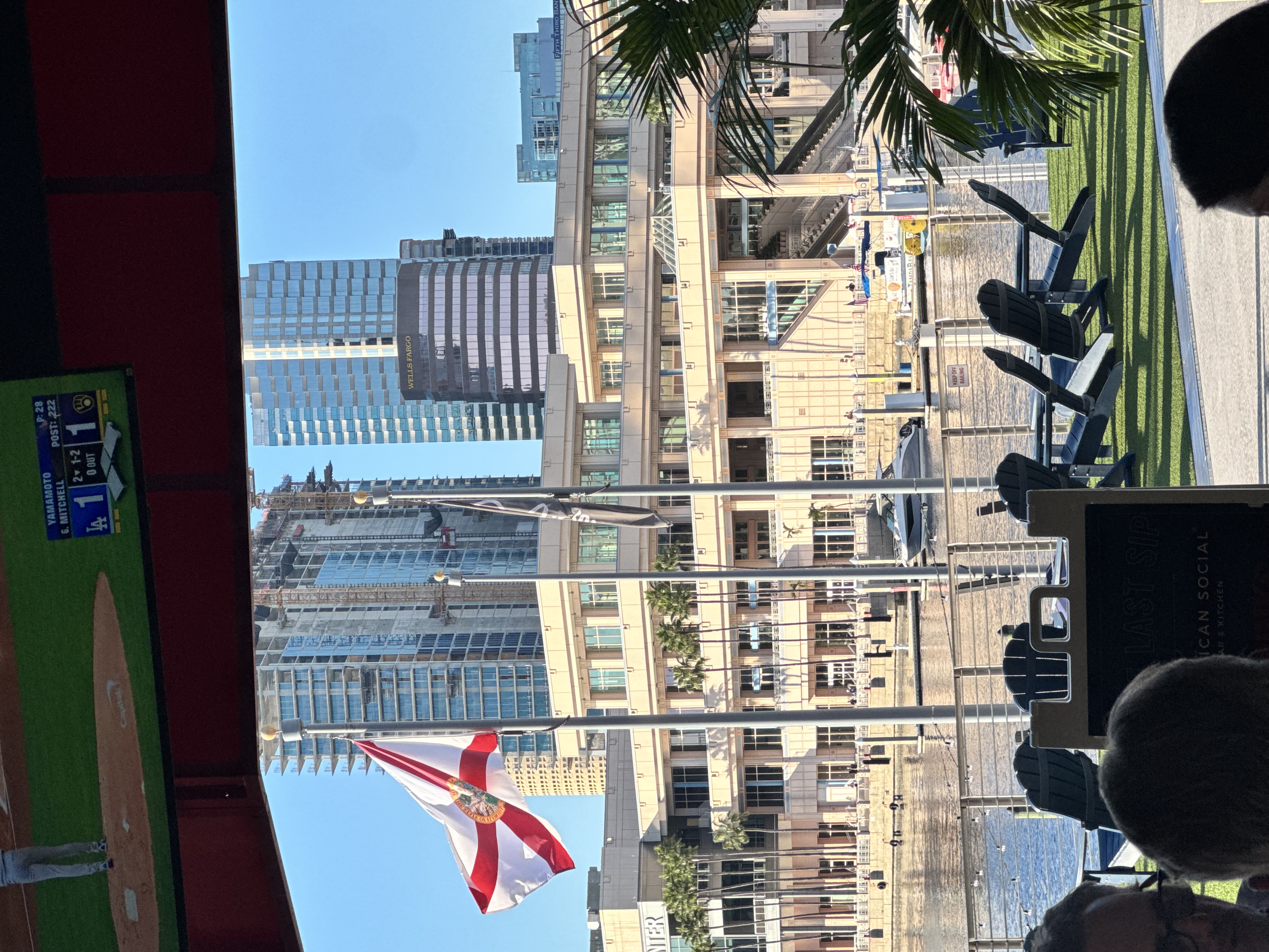 Florida state flag flying over downtown Tampa