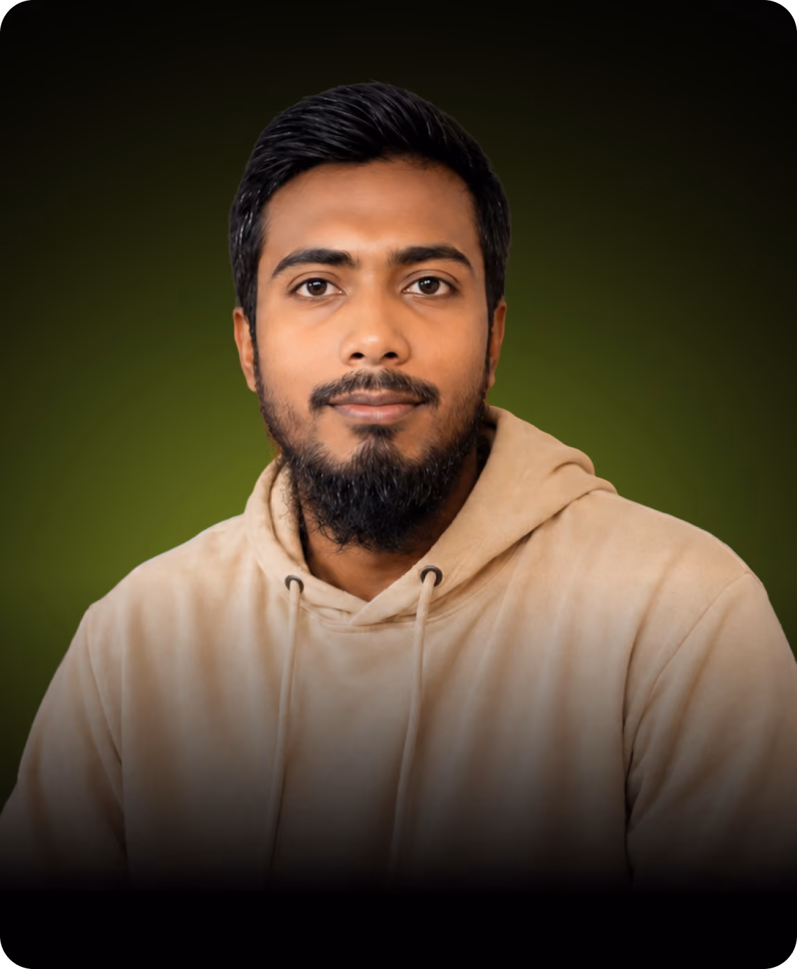 Portrait of a man with a beard wearing a beige hoodie against a green background.