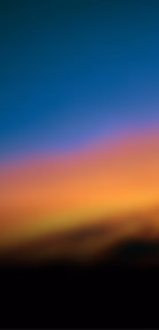 Blurred gradient background with dark blue top fading to pink and orange hues at the bottom.