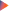 A glowing pink gradient triangle on a black background.