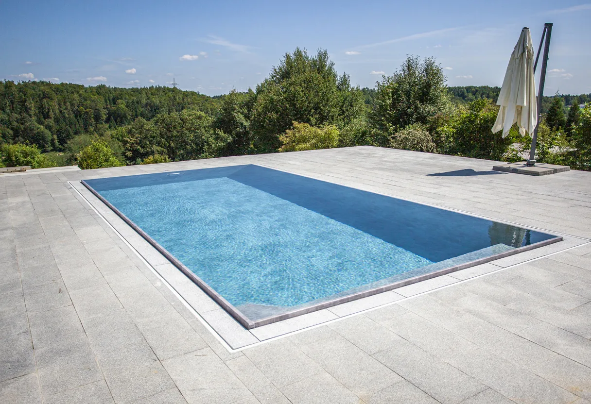 RENOLIT ALKORPLAN pool liner in a blue tiled swimming pool