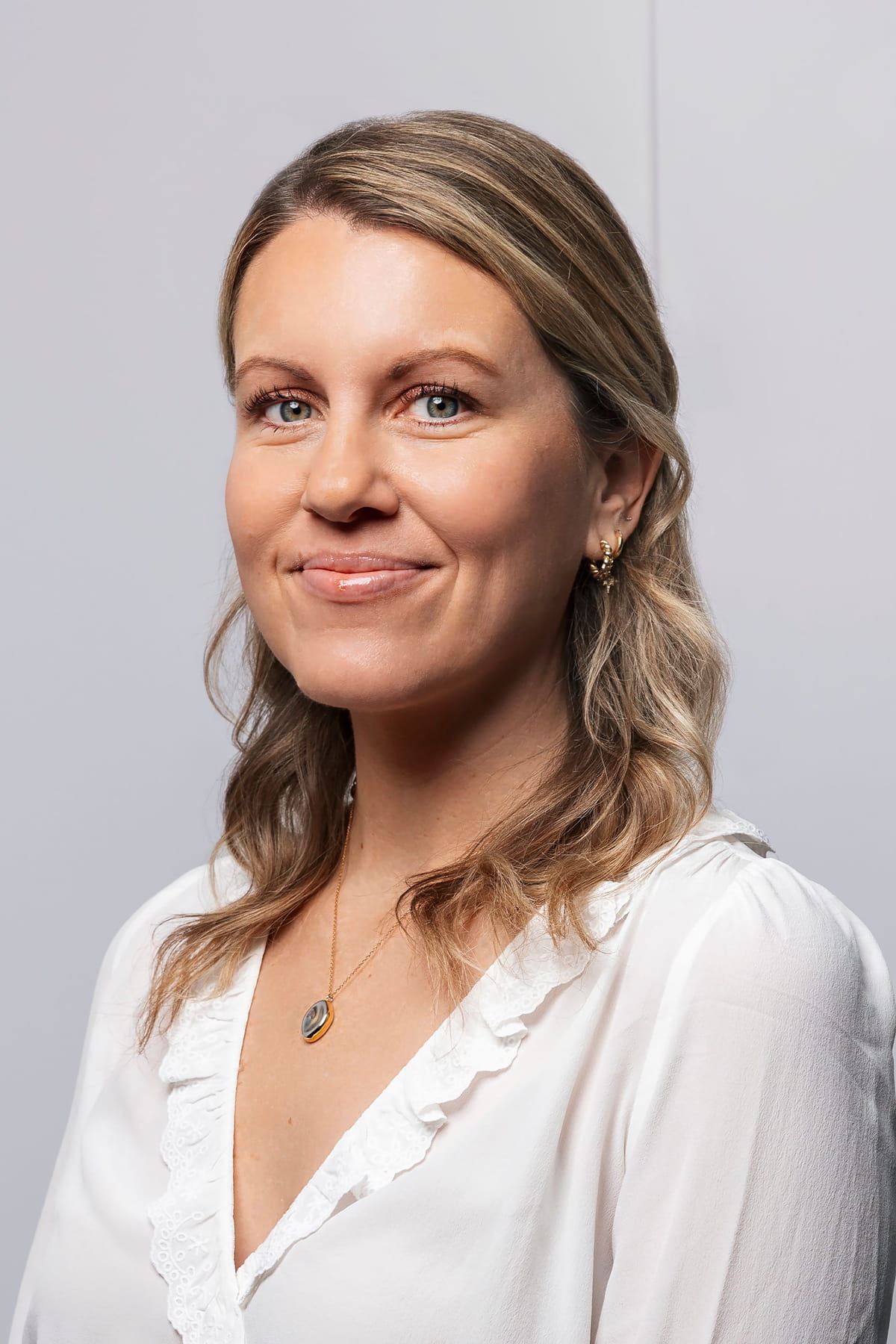 Portrait photo of woman in front of white background