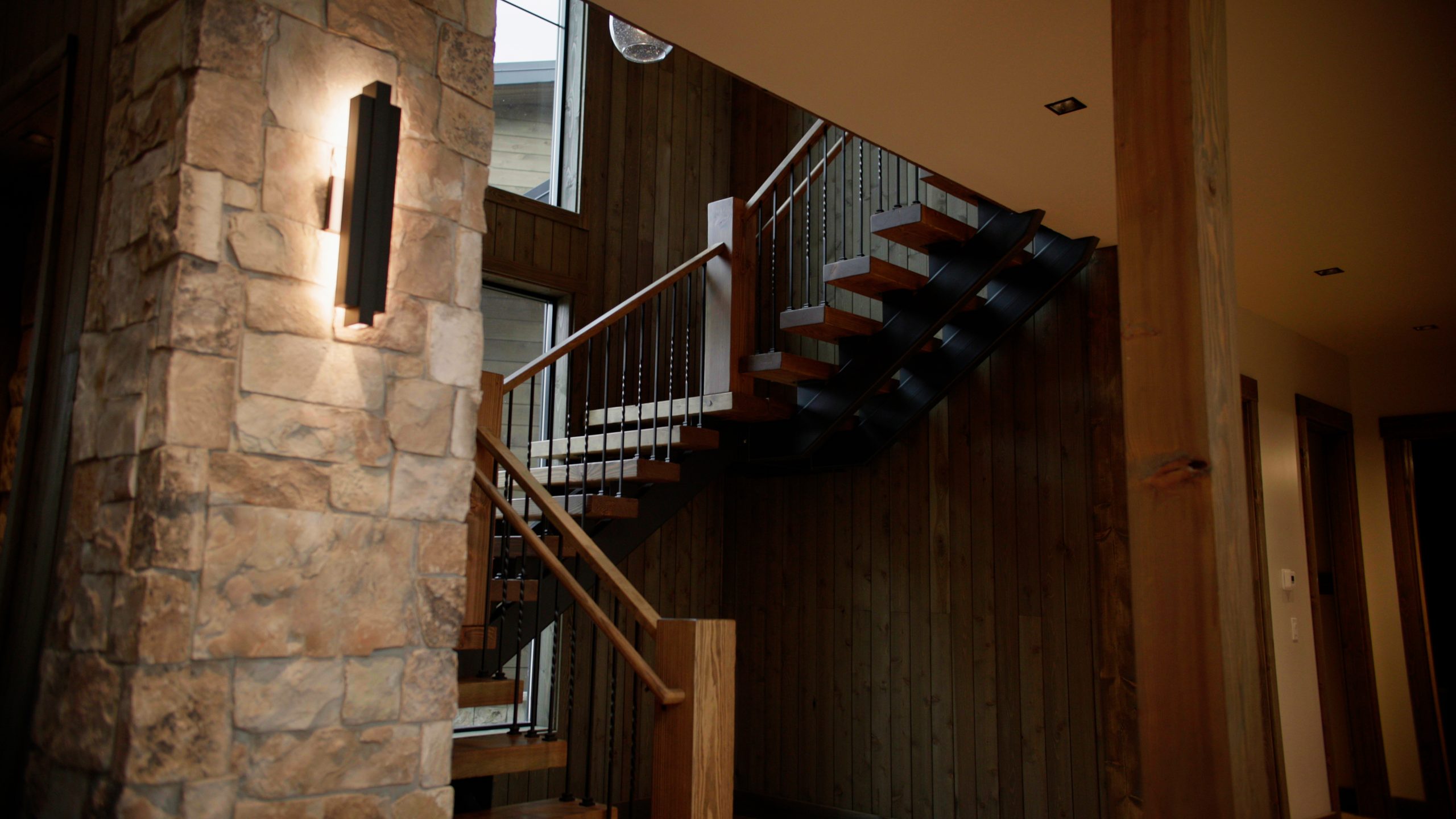 Structural detail in a Hearthstone home: stair joinery and timber framing