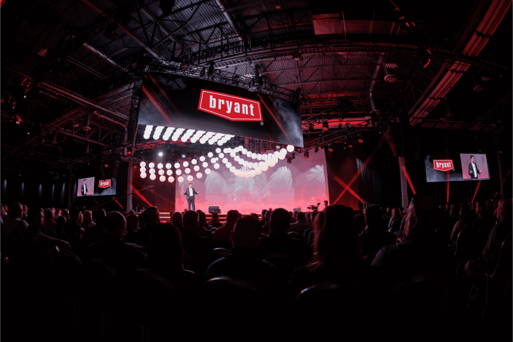A large-scale stage and visual design for Bryant NDC, creating an immersive, high-energy experience through bold graphics and dynamic LED content.