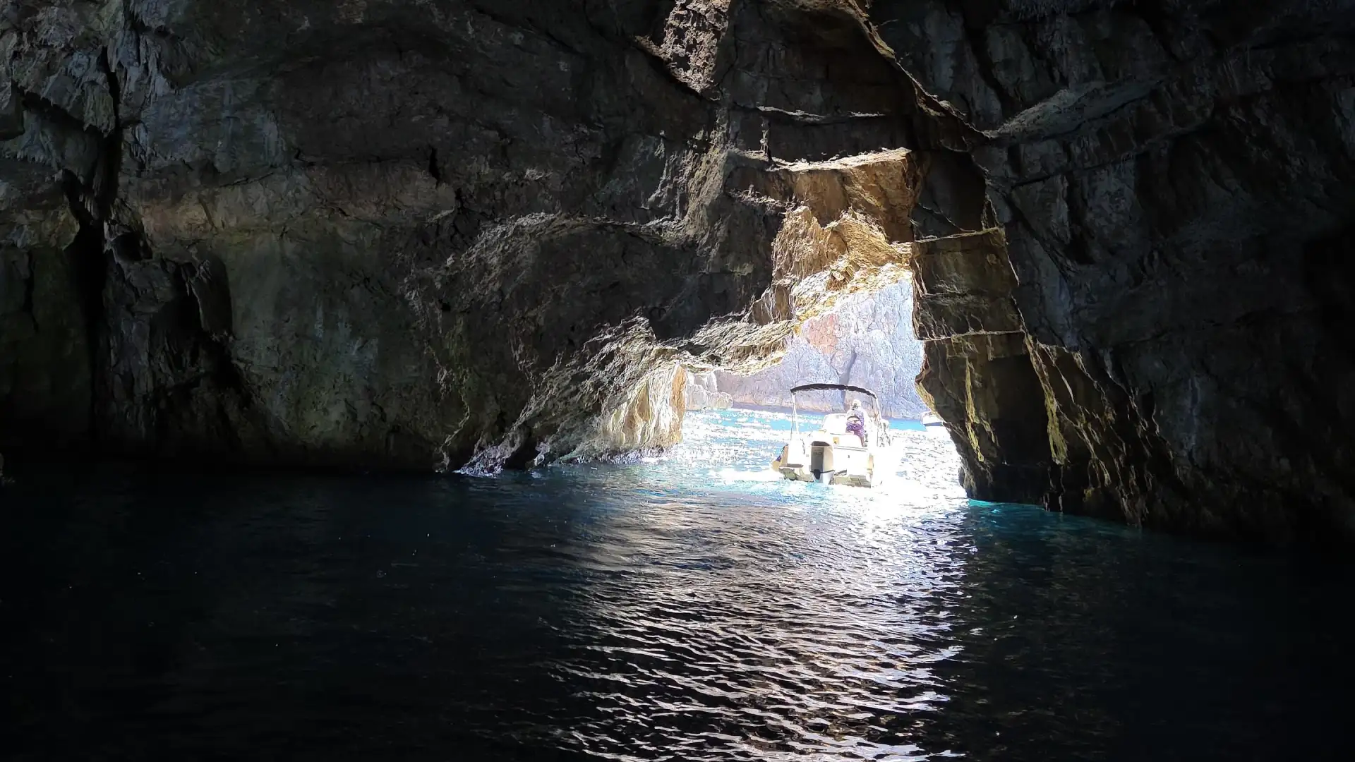 Guests swimming inside the Blue Cave during a private speedboat tour from Kotor Montenegro