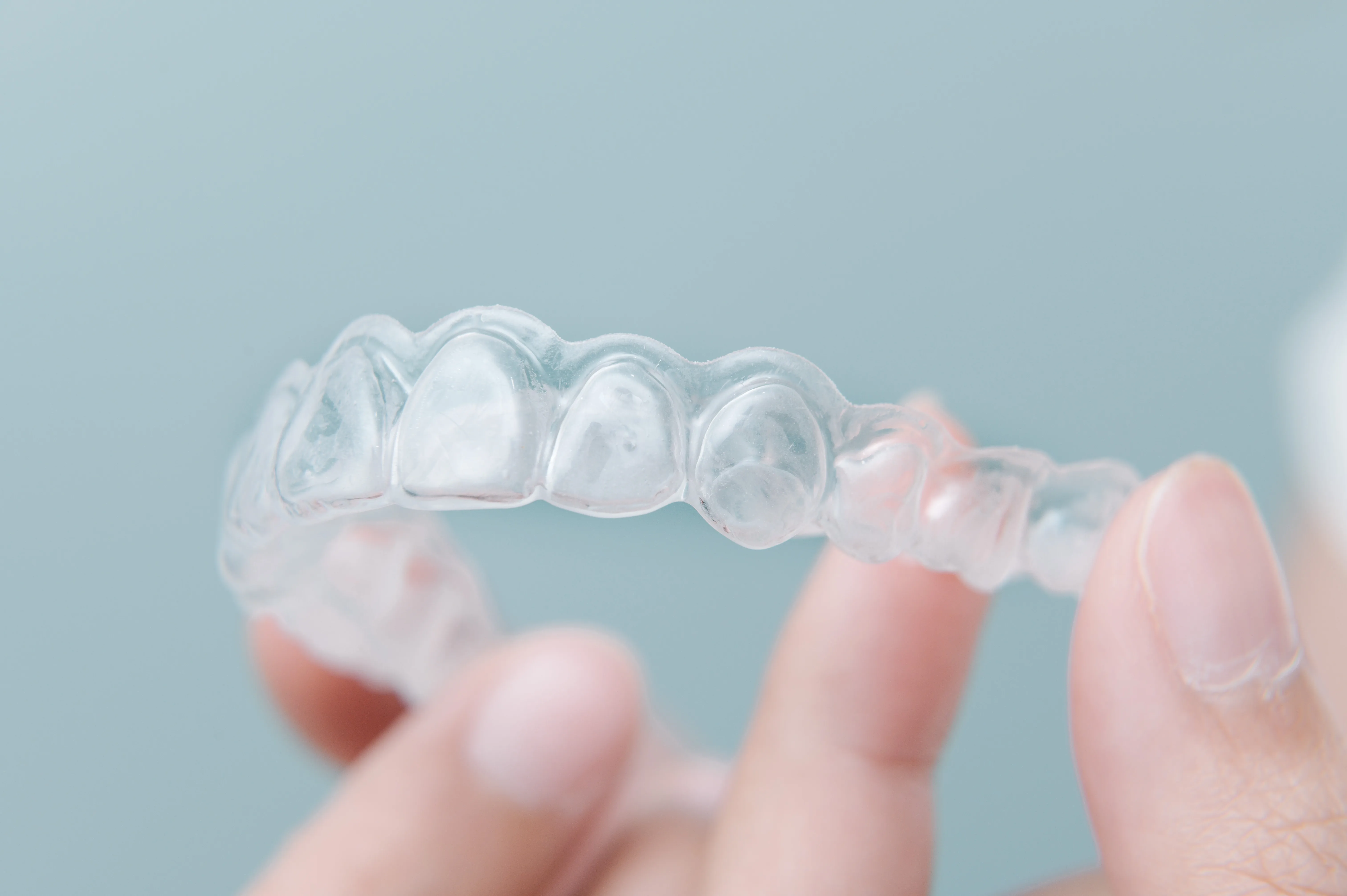 Close view of a clear aligner tray used in SimplyClear treatment
