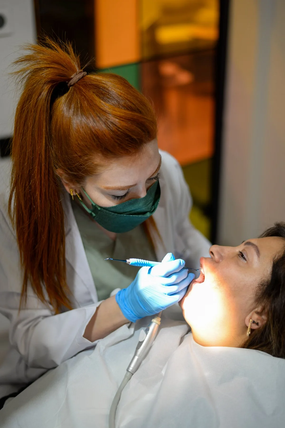 Dentist performing a detailed dental exam