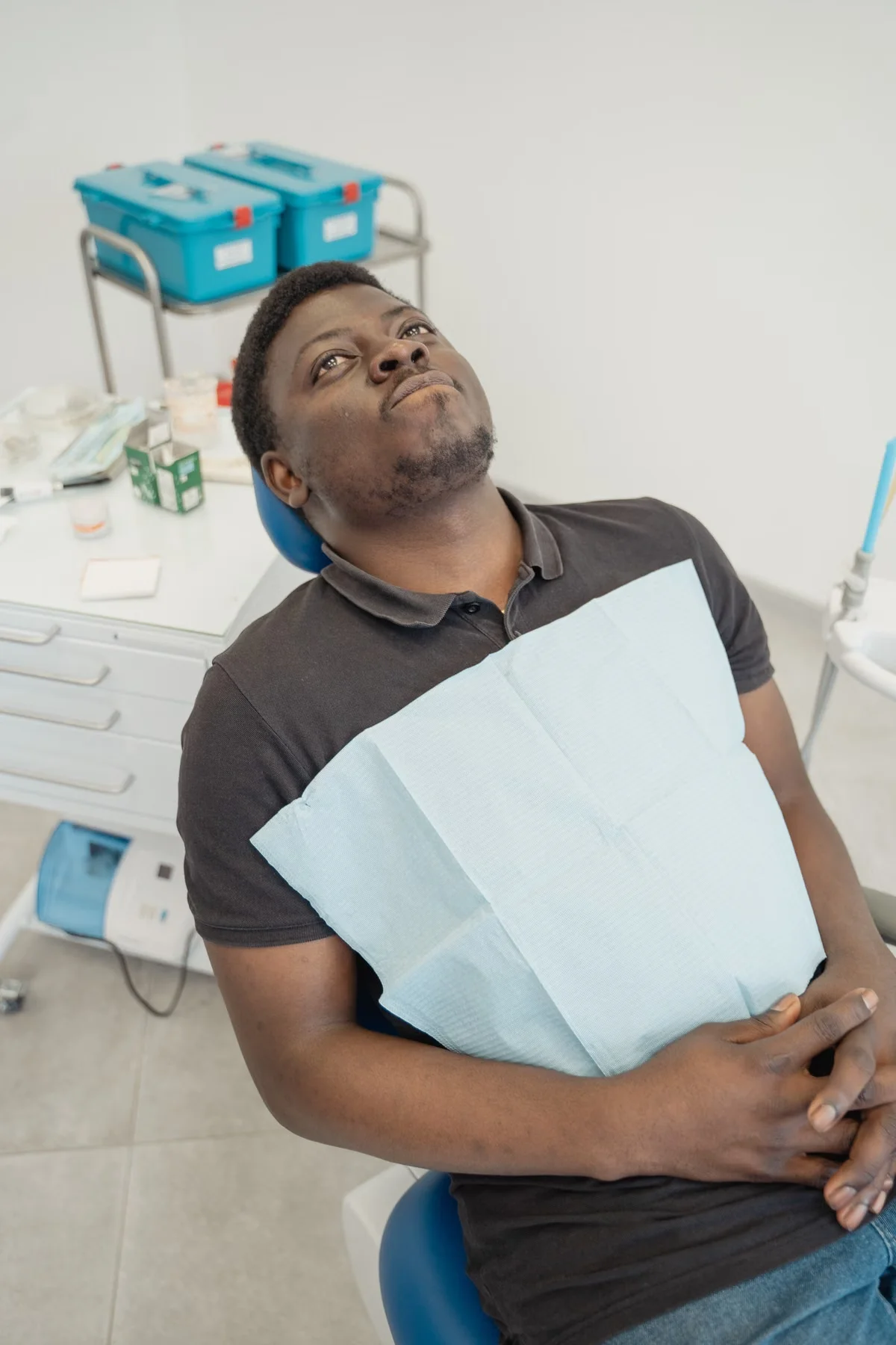 Relaxed patient resting comfortably in a dental chair