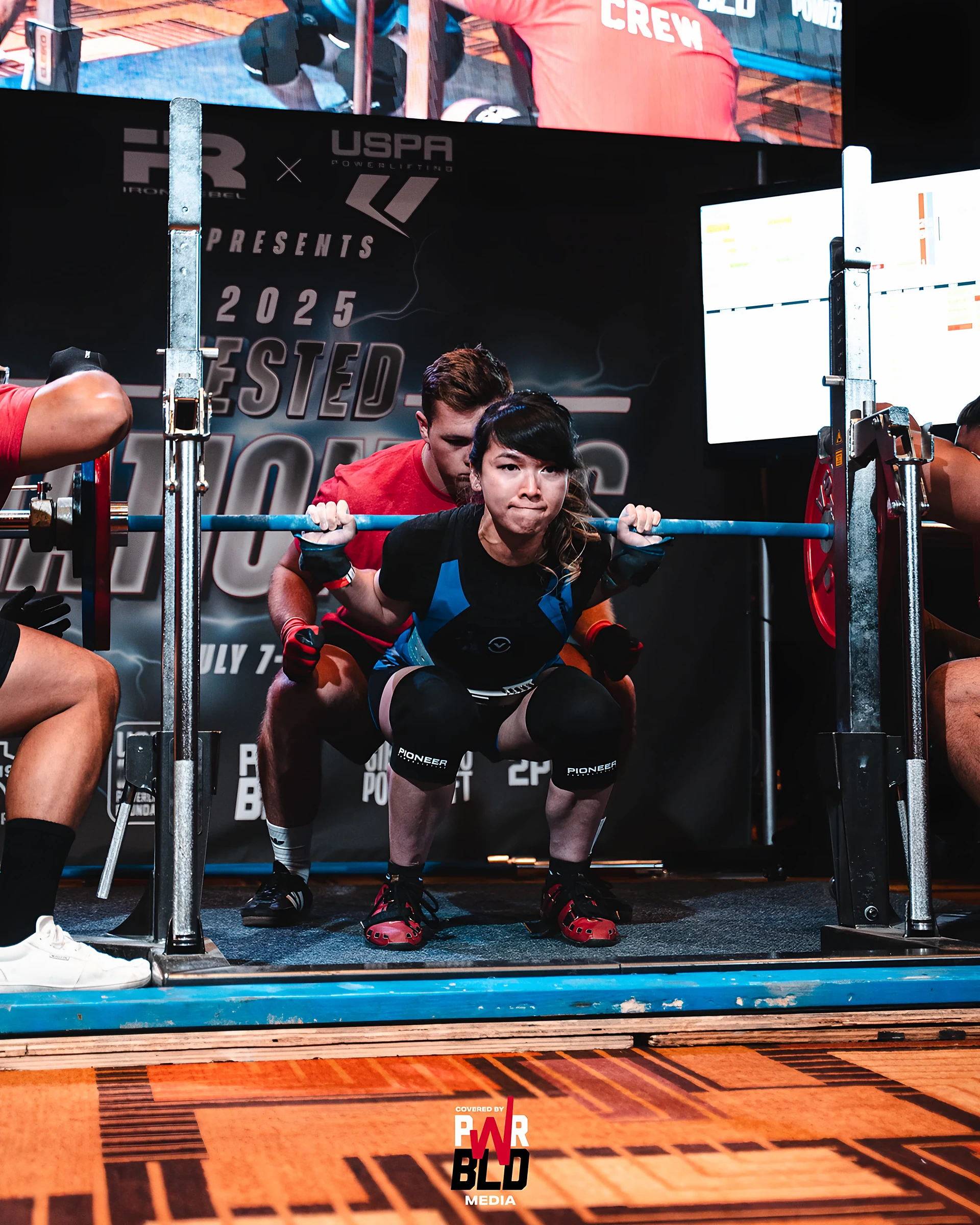 Dr. Gloria Luong competing in the squat at a 2025 USPA powerlifting meet
